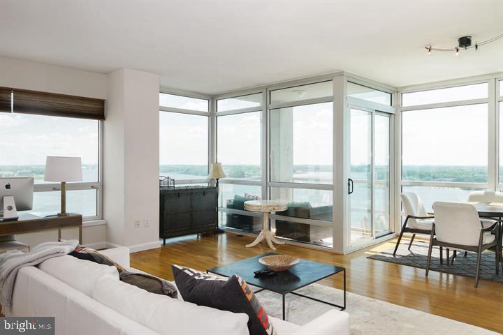 901 North Penn Street, Unit R1501 Philadelphia, PA 19123 - Photo 2 of 25 a living room with furniture and a large window