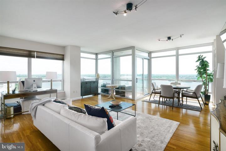 901 North Penn Street, Unit R1501 Philadelphia, PA 19123 - Photo 3 of 25 a living room with furniture and a large window