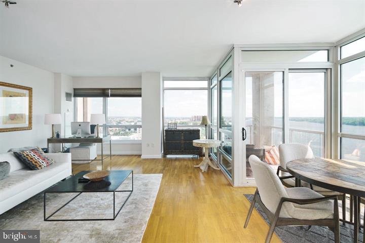 901 North Penn Street, Unit R1501 Philadelphia, PA 19123 - Photo 4 of 25 a living room with furniture and a large window
