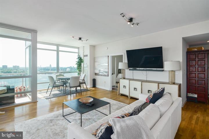 901 North Penn Street, Unit R1501 Philadelphia, PA 19123 - Photo 5 of 25 a living room with furniture and a flat screen tv