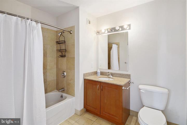 901 North Penn Street, Unit R1501 Philadelphia, PA 19123 - Photo 10 of 25 a bathroom with a granite countertop sink toilet and shower