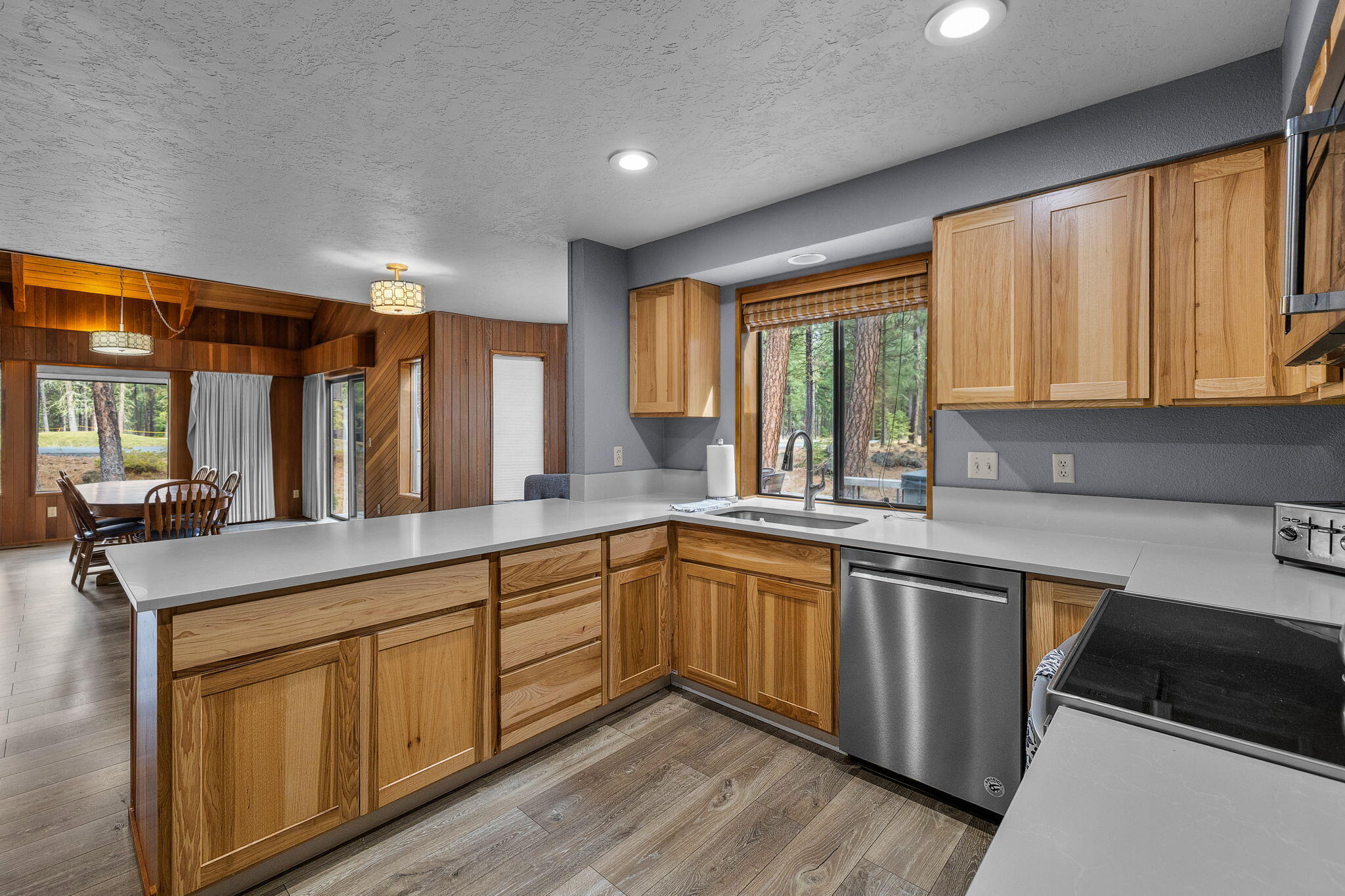 13168 Hawks Beard Black Butte Ranch, OR 97759 - Photo 4 of 47 a kitchen with sink cabinets and wooden floor