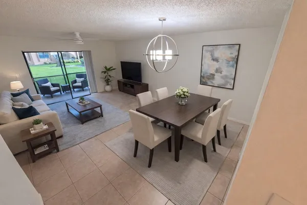 a view of a livingroom with furniture and a window