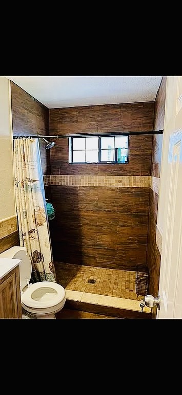 8606 Prima Street Houston, TX 77083 - Photo 16 of 32 Custom converted tub into walk in shower