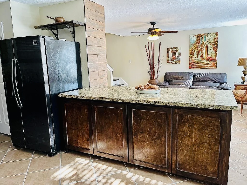 8606 Prima Street Houston, TX 77083 - Photo 5 of 32 Custom cabinets and granite top breakfast bar