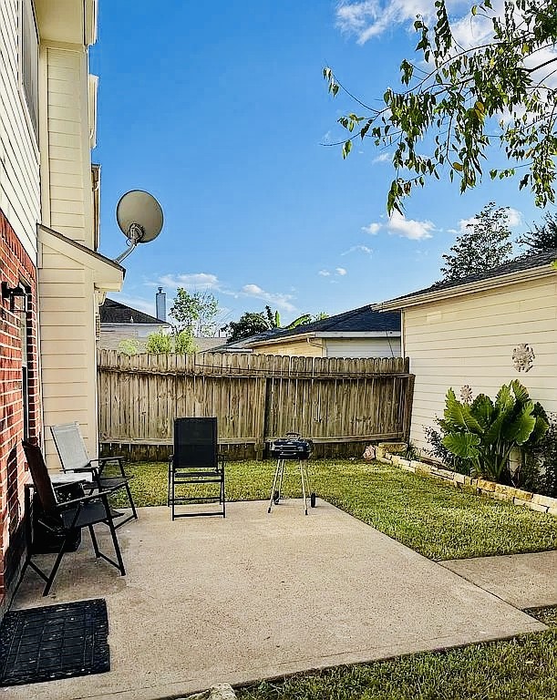 8606 Prima Street Houston, TX 77083 - Photo 10 of 32 Backyard patio now has a pavilion and outdoor fire kitchen area