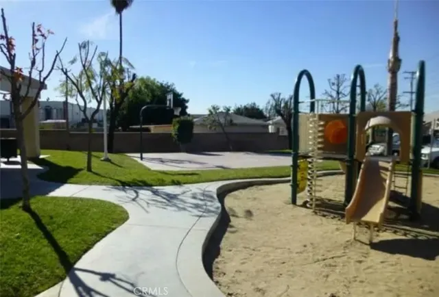 a view of a swimming pool with a yard