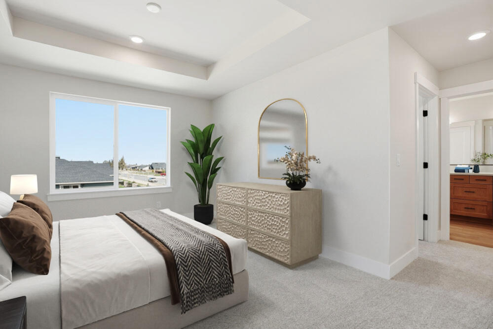 60843 Southeast Epic Place Bend, OR 97702 - Photo 5 of 13 a spacious bedroom with a bed a couch and a potted plant