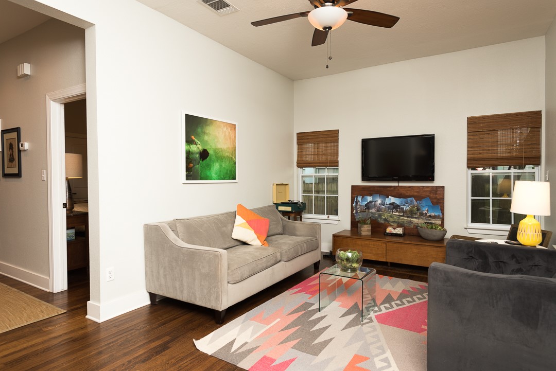 2805 Lafayette Avenue Austin, TX 78722 - Photo 13 of 23 Living room with wood finished floors, a ceiling fan, and baseboards
