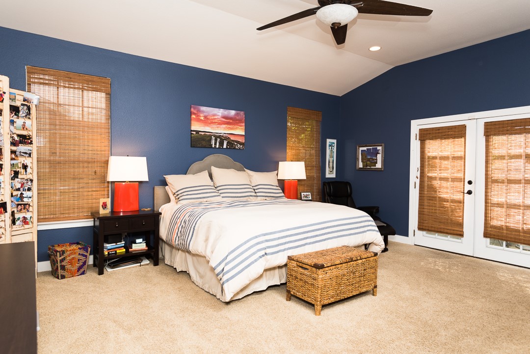 2805 Lafayette Avenue Austin, TX 78722 - Photo 16 of 23 Bedroom featuring carpet floors, access to outside, vaulted ceiling, french doors, and a ceiling fan