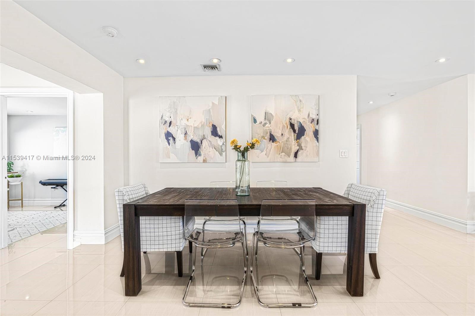 1301 Southwest 99th Court Miami, FL 33174 - Photo 12 of 35 a view of a dining room with furniture and window