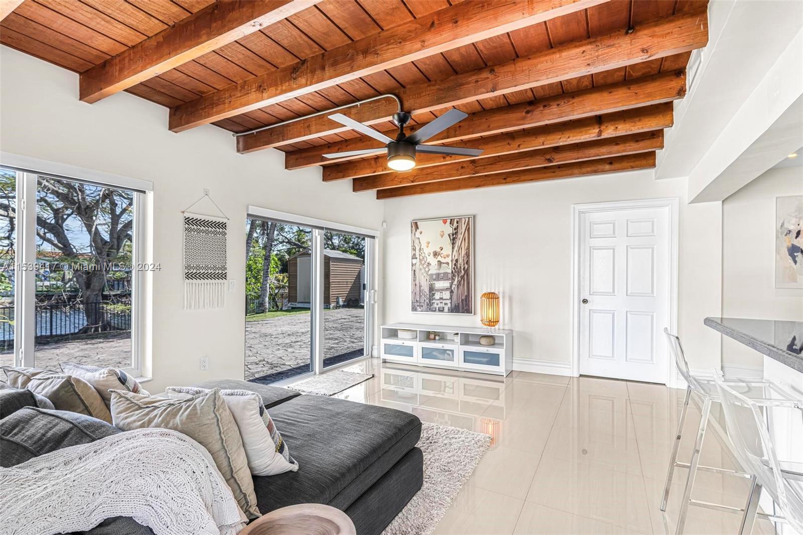 1301 Southwest 99th Court Miami, FL 33174 - Photo 14 of 35 a living room with furniture and a ceiling fan