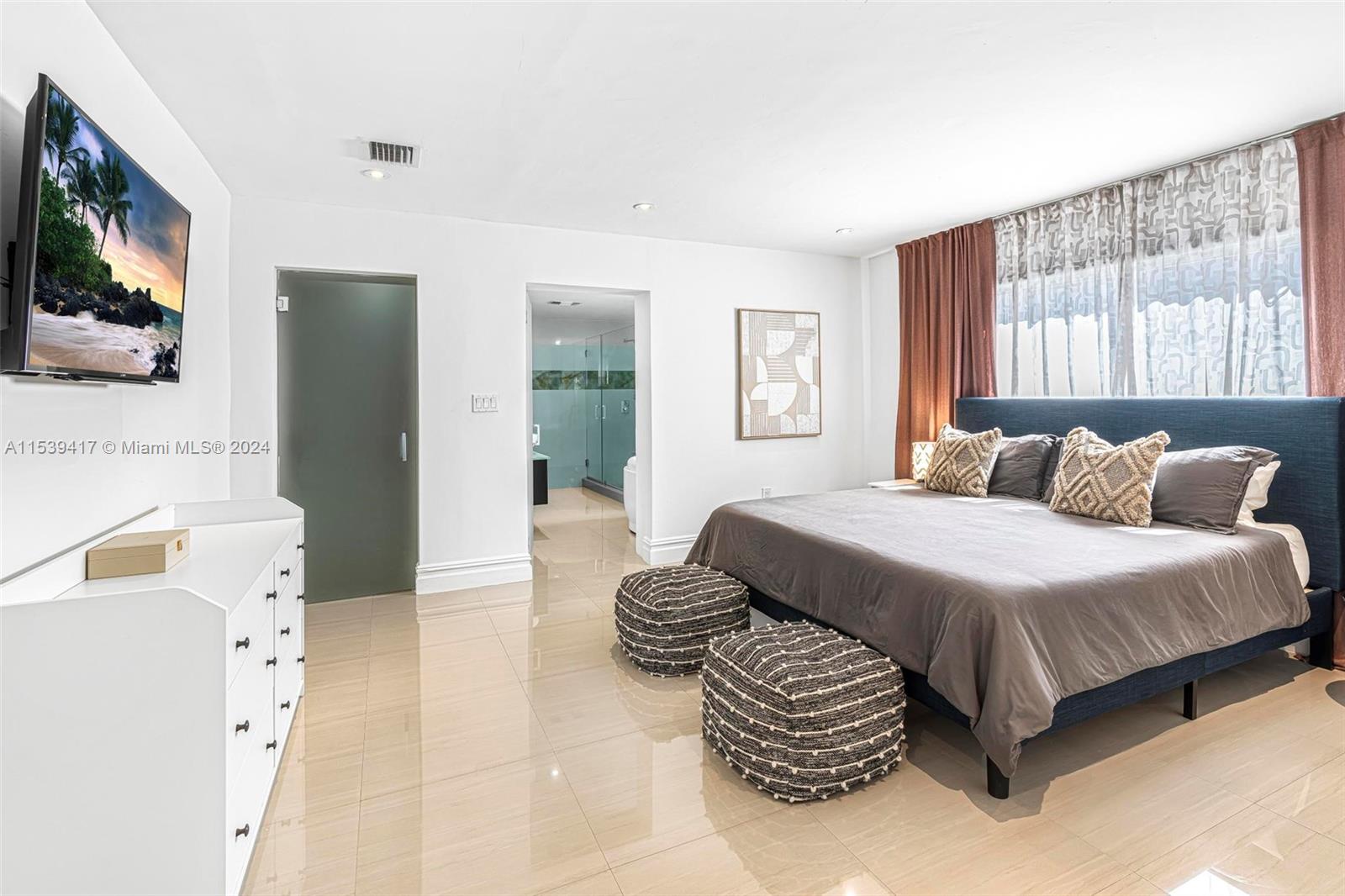 1301 Southwest 99th Court Miami, FL 33174 - Photo 16 of 35 a bedroom with a bed and a flat screen tv