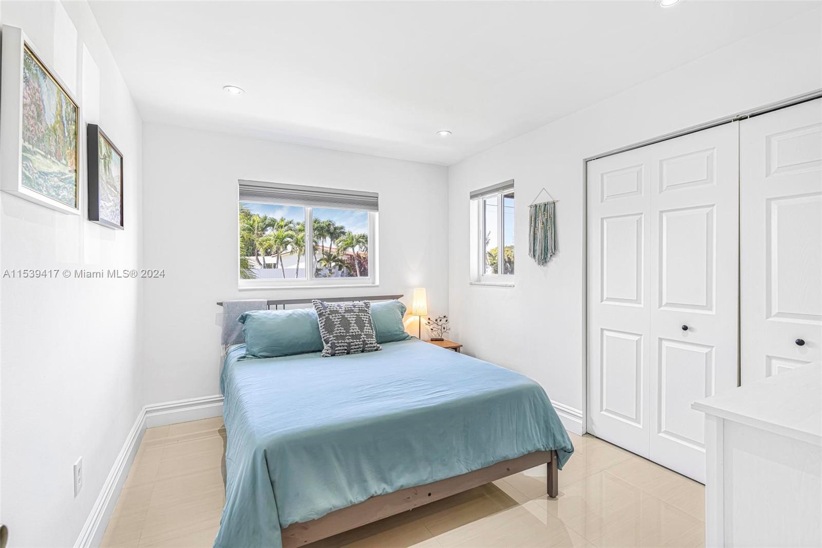 1301 Southwest 99th Court Miami, FL 33174 - Photo 20 of 35 a bedroom with a large bed and a window