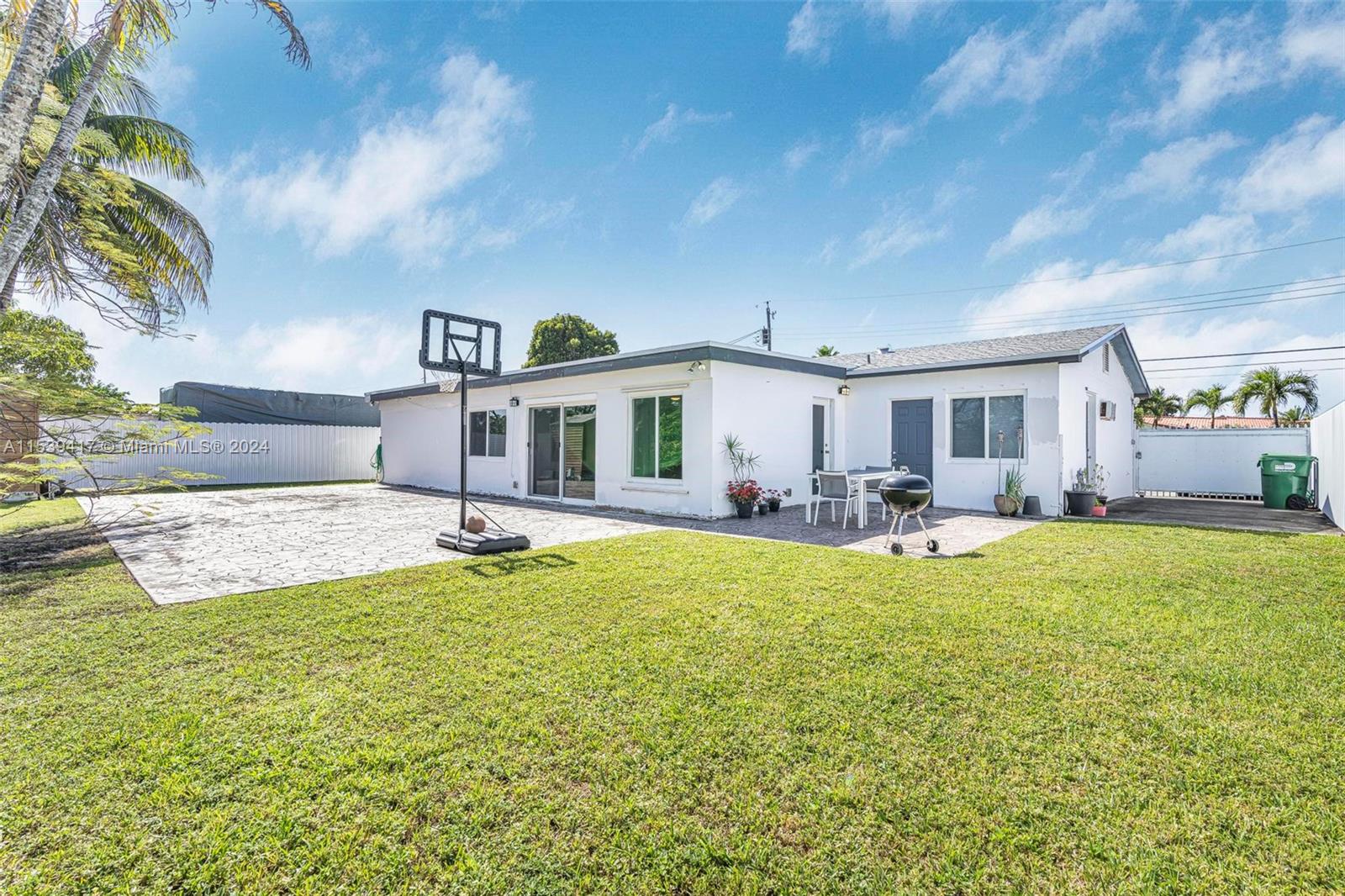 1301 Southwest 99th Court Miami, FL 33174 - Photo 23 of 35 a view of a house with swimming pool and a yard