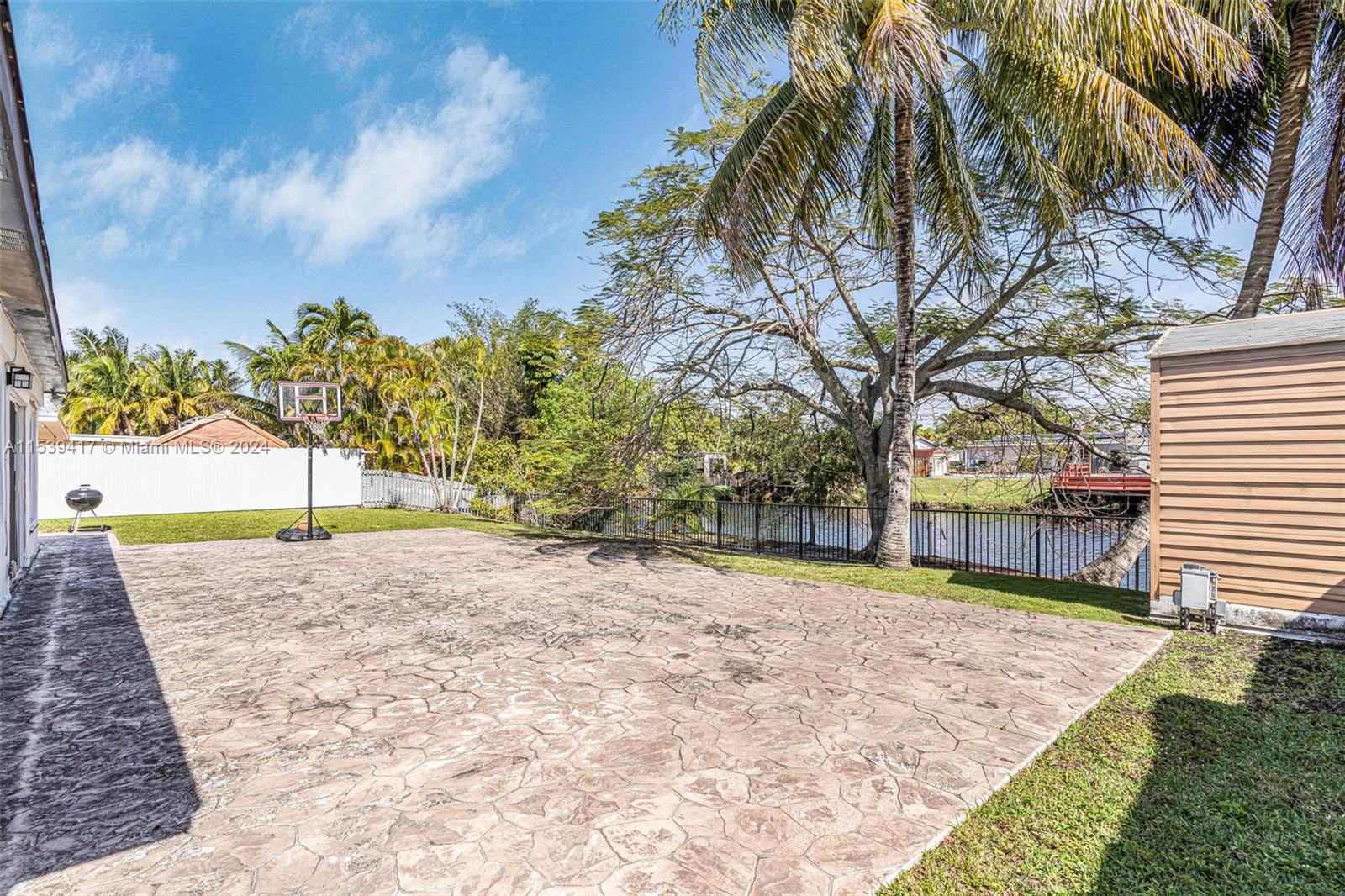 1301 Southwest 99th Court Miami, FL 33174 - Photo 26 of 35 a view of a yard with plants and trees