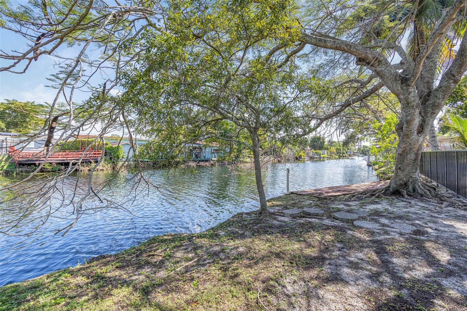 1301 Southwest 99th Court Miami, FL 33174 - Photo 28 of 35 a view of a backyard with large trees
