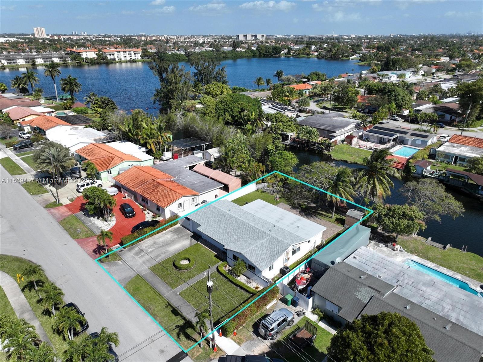 1301 Southwest 99th Court Miami, FL 33174 - Photo 31 of 35 an aerial view of multiple houses with yard