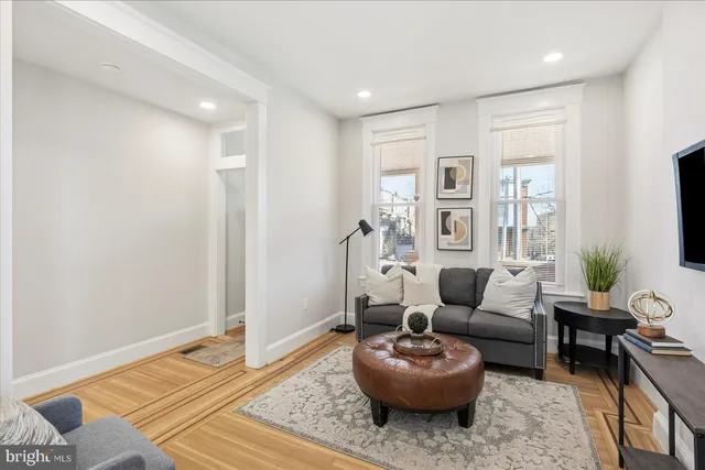 a living room with furniture and a rug