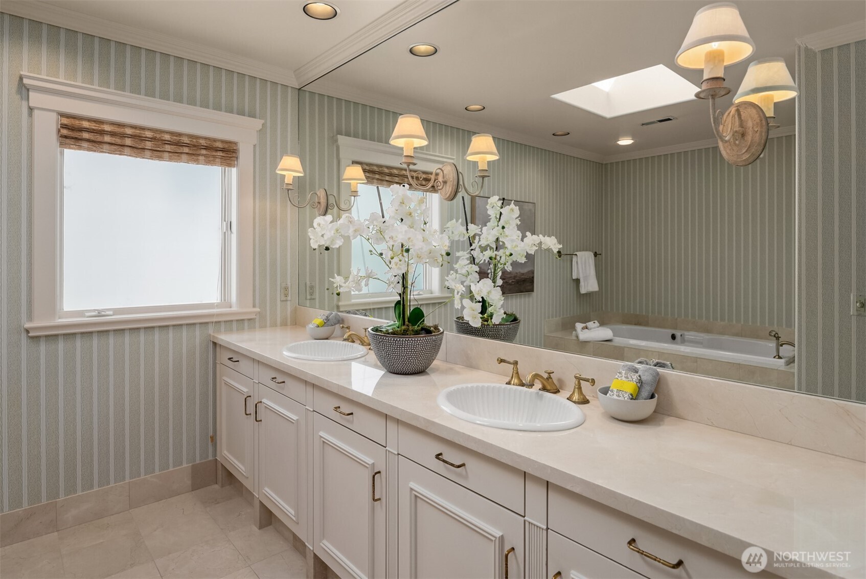 4640 95th Avenue Northeast Yarrow Point, WA 98004 - Photo 18 of 33 a bathroom with a sink a large mirror and a shower