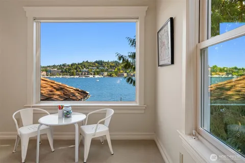 a view of a balcony with furniture and a window