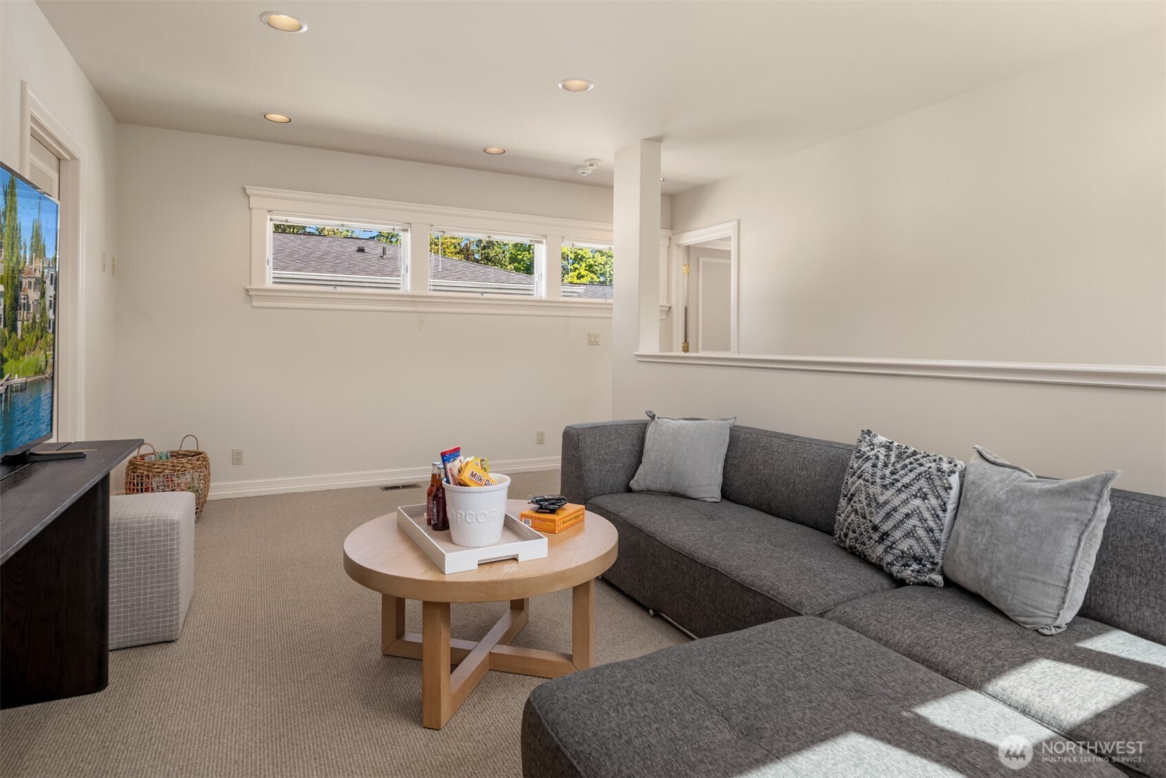 4640 95th Avenue Northeast Yarrow Point, WA 98004 - Photo 24 of 33 a living room with furniture and a window
