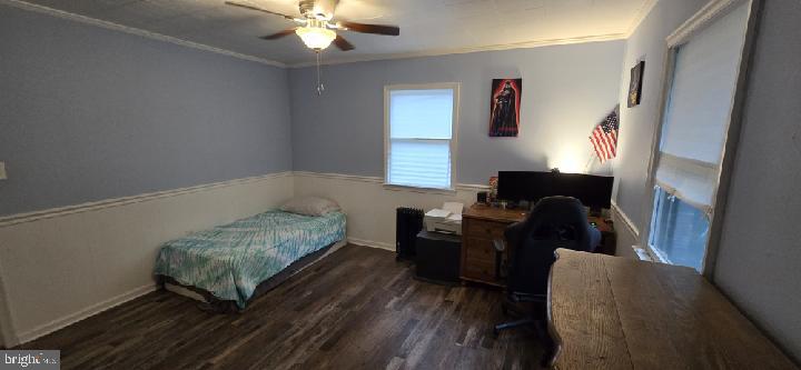 152 Onley Road Salisbury, MD 21804 - Photo 8 of 11 a bedroom with a bed and a chandelier