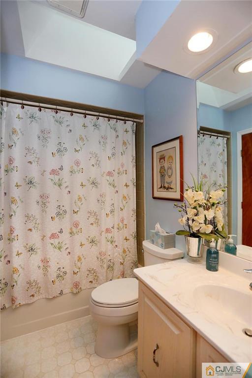 1206 Maplecrest Road Edison, NJ 08820 - Photo 15 of 15 a bathroom with a sink a toilet and a shower