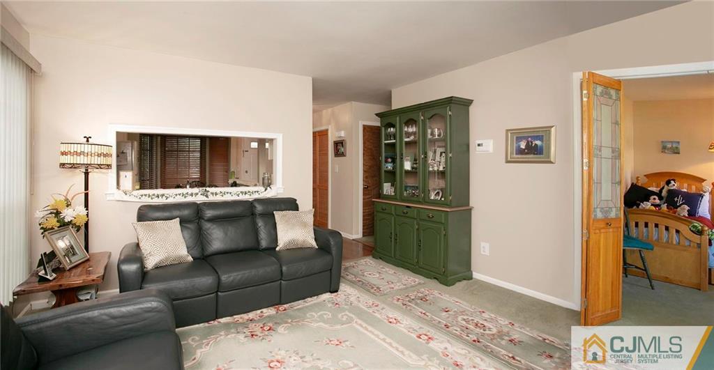 1206 Maplecrest Road Edison, NJ 08820 - Photo 6 of 15 a living room with furniture and a flat screen tv