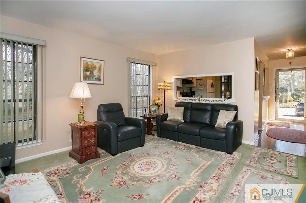 1206 Maplecrest Road Edison, NJ 08820 - Photo 7 of 15 a living room with furniture and a fireplace