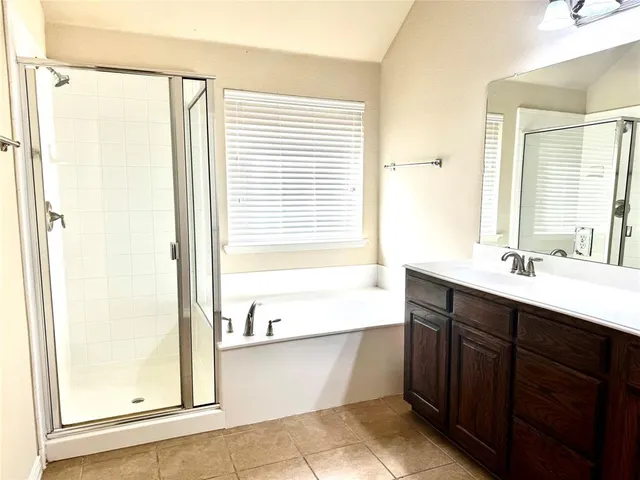 a bathroom with a bathtub and a sink