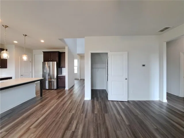 a view of livingroom with hardwood floor and hallway