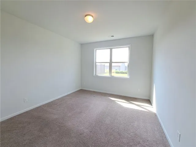 a bathroom with a bathtub shower sink mirror vanity and a toilet