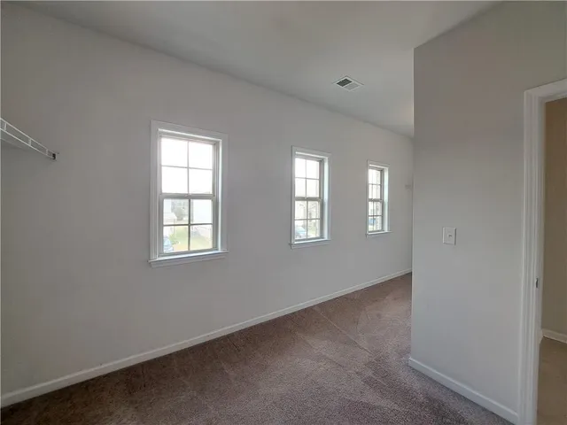 a bathroom with a double vanity sink and mirror