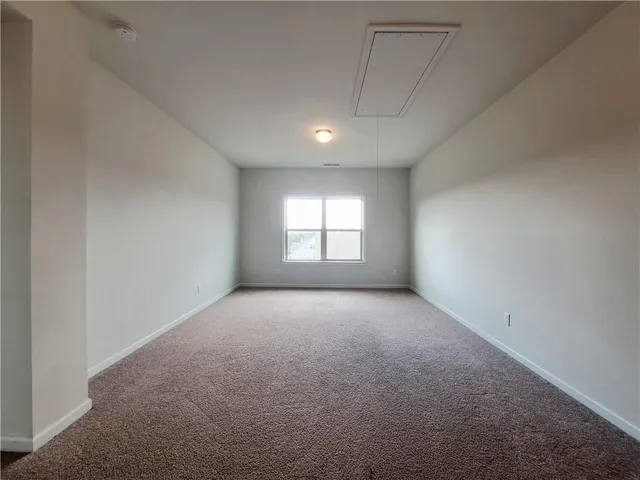 a view of an empty room and entryway