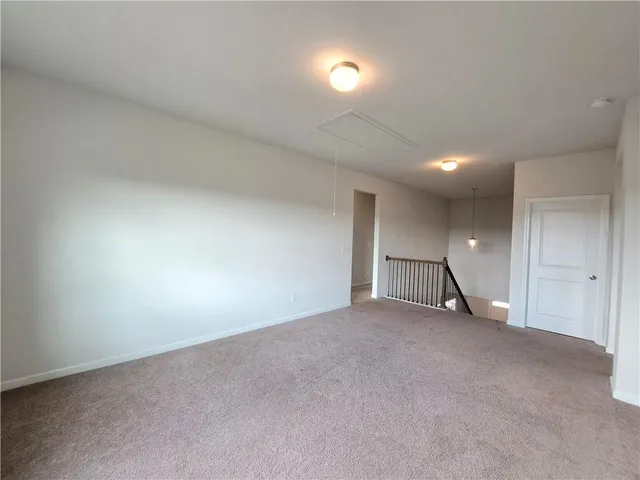 an empty room with a empty space and a window