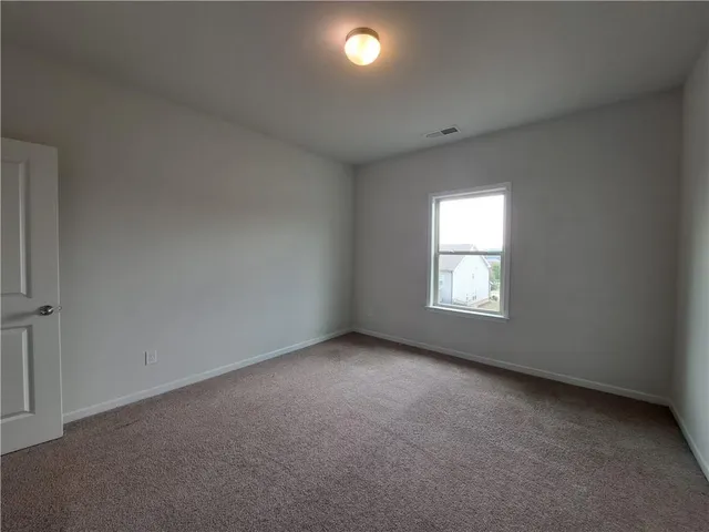 a view of a house with a big yard