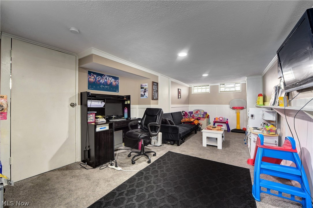 1149 Avondale Road Cleveland, OH 44121 - Photo 22 of 28 Home office with light carpet and a textured ceiling