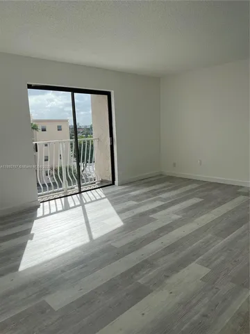 an empty room with entrance door