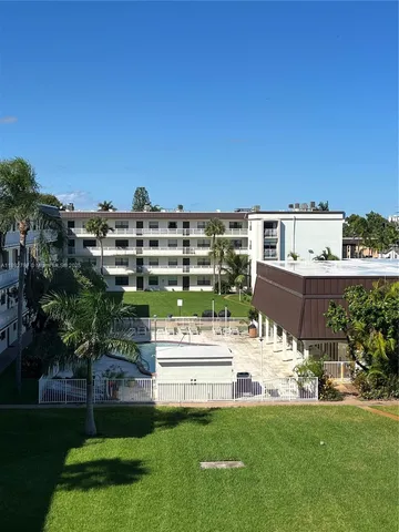 a view of a building with a yard