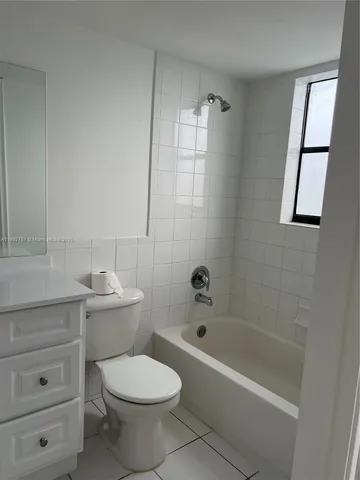 a bathroom with a toilet a sink and bathtub