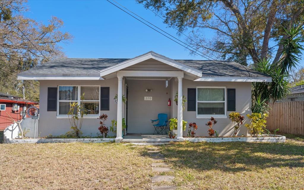 370 3rd Street Northwest Largo, FL 33770 - Photo 1 of 1 a front view of a house with garden
