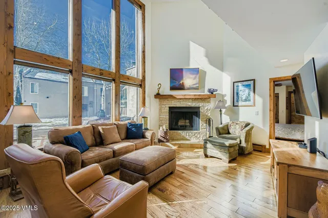 a living room with furniture fireplace and a flat screen tv