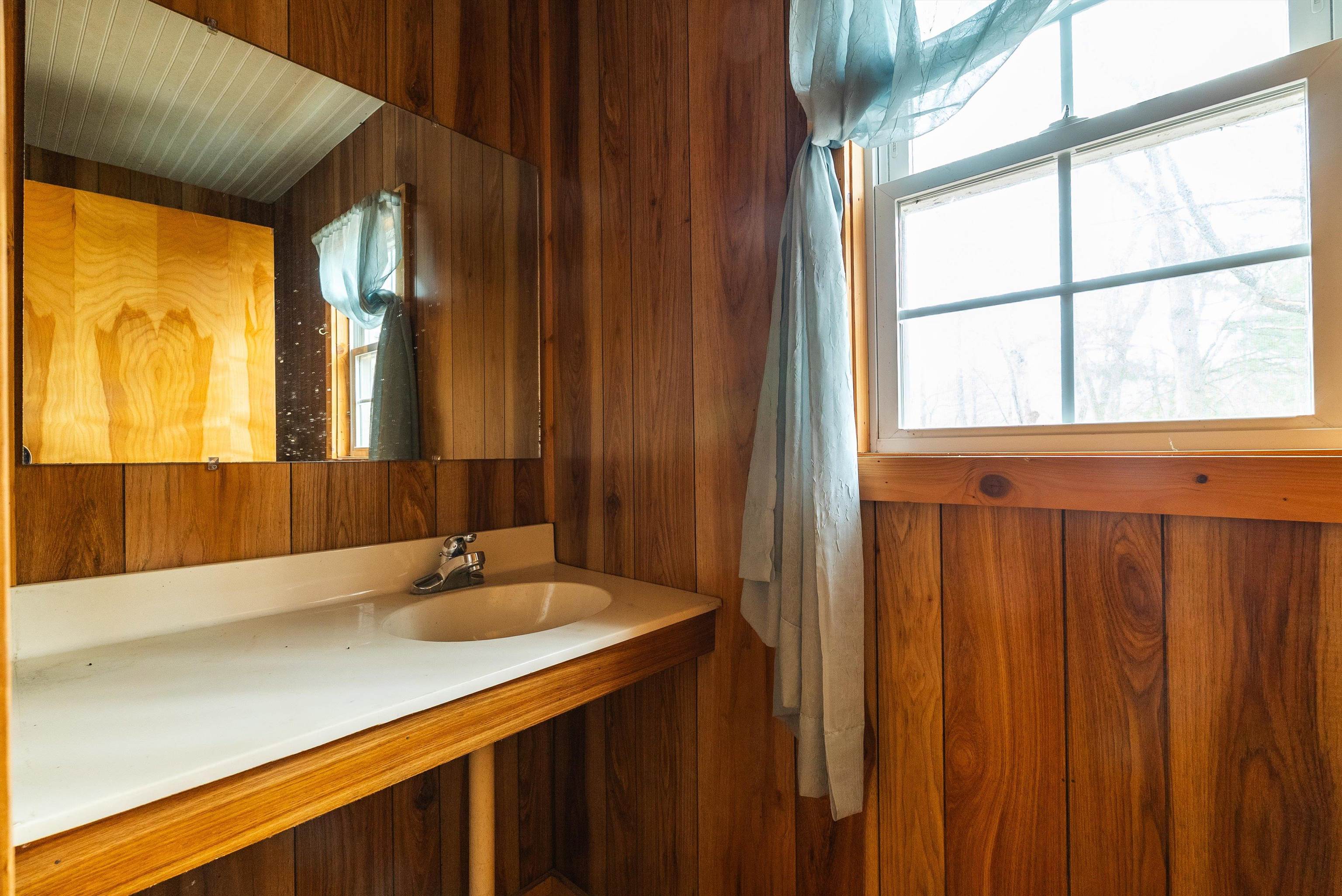 163-acres Hopkins Gap Road Fulks Run, VA 22830 - Photo 16 of 75 a bathroom with a sink and a mirror