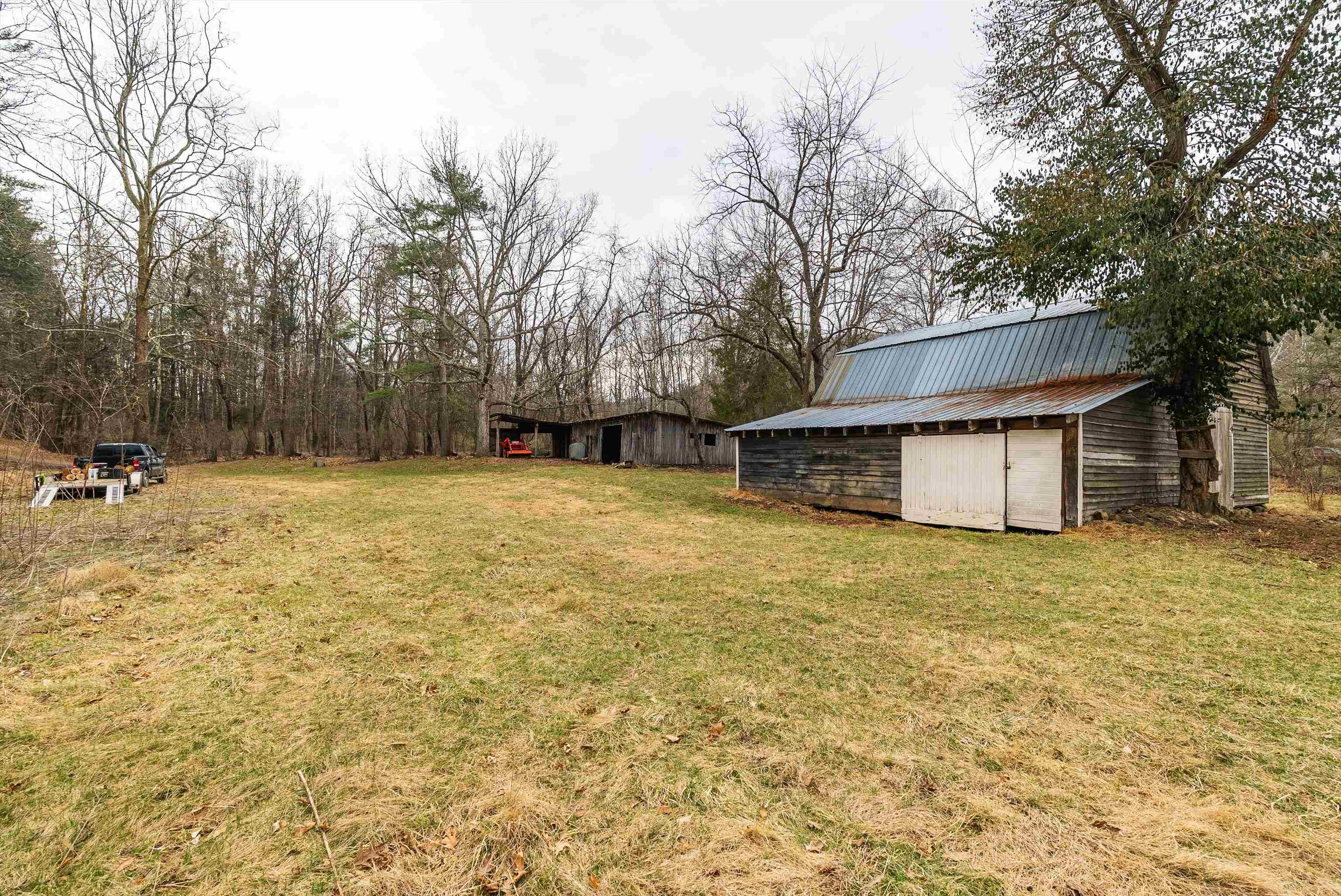 163-acres Hopkins Gap Road Fulks Run, VA 22830 - Photo 32 of 75 a backyard of a house with table and chairs