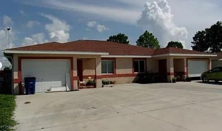 a view of a house with table and chairs in front of house