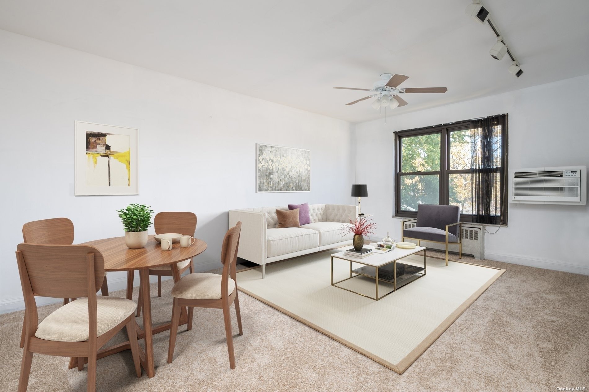 a living room with furniture a large window and a table