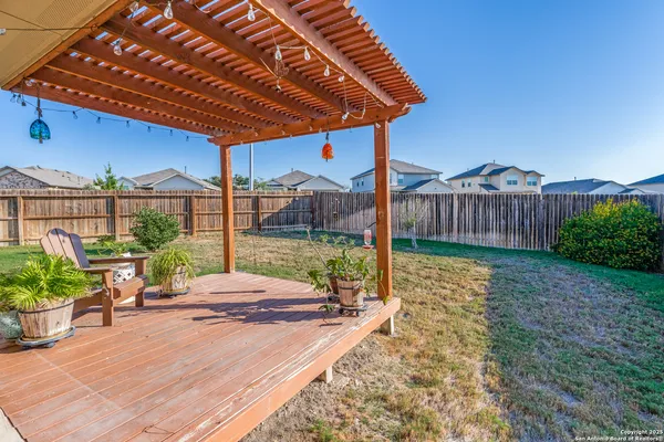 a view of a house with backyard porch and sitting area