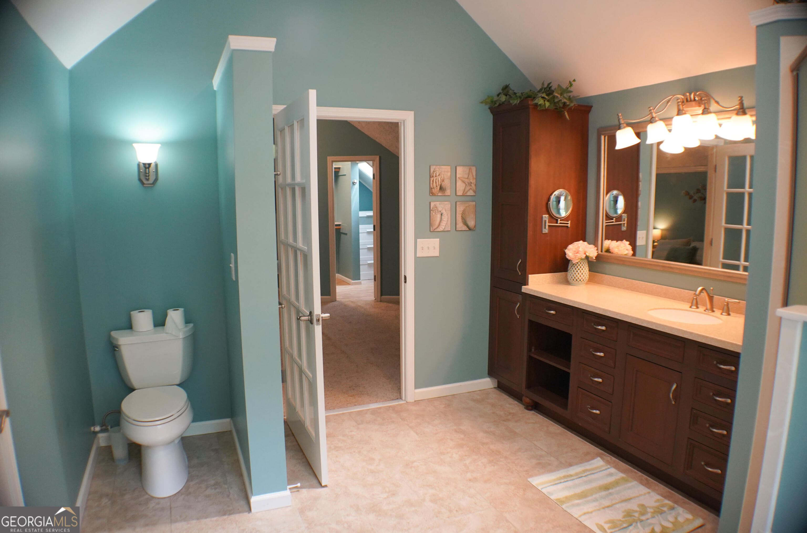 335 Winding Stream Trail Hampton, GA 30228 - Photo 22 of 35 a spacious bathroom with a toilet sink and mirror