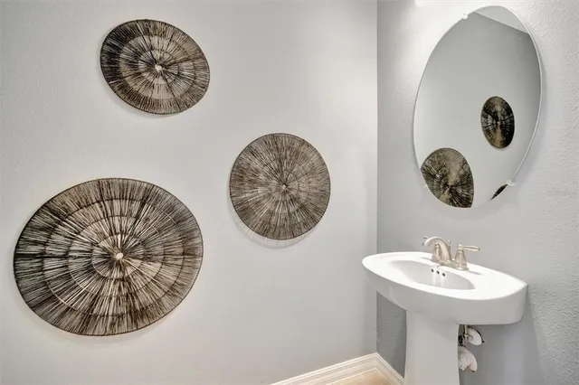 a kitchen with microwave a stove and chairs